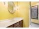 Bathroom featuring an ornate mirror and a glass enclosed shower at 22453 Hillcrest Cir, Golden, CO 80401