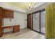 Charming dining area featuring floral wallpaper and sliding glass door at 22453 Hillcrest Cir, Golden, CO 80401