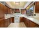 Well-maintained kitchen with wooden cabinets, modern appliances, and plenty of natural light at 22453 Hillcrest Cir, Golden, CO 80401