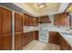 Classic kitchen with wooden cabinets and modern white appliances at 22453 Hillcrest Cir, Golden, CO 80401