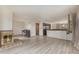 Bright living room featuring a cozy fireplace and access to other rooms at 22453 Hillcrest Cir, Golden, CO 80401