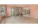 Open living room with a stone fireplace, hardwood floors, and natural light at 22453 Hillcrest Cir, Golden, CO 80401