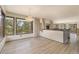 Open-concept living room with large windows, chandelier, and access to other rooms at 22453 Hillcrest Cir, Golden, CO 80401