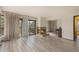 Spacious living room with a charming fireplace, balcony access and a piano at 22453 Hillcrest Cir, Golden, CO 80401