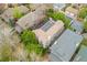 Aerial view of home showing roof, surrounding trees, and neighborhood setting at 635 N Williams St, Denver, CO 80218