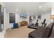Finished basement features recreational equipment, a large television, and comfortable seating at 635 N Williams St, Denver, CO 80218