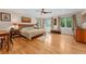 Bright bedroom with hardwood floors, large windows, and a ceiling fan at 635 N Williams St, Denver, CO 80218
