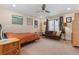 Bedroom with neutral paint, ceiling fan, and window with sofa and side tables at 635 N Williams St, Denver, CO 80218