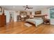 Spacious bedroom with hardwood floors, ample natural light, and comfortable furnishings at 635 N Williams St, Denver, CO 80218