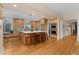 Spacious kitchen featuring a large center island, stainless steel appliances, and hardwood floors at 635 N Williams St, Denver, CO 80218
