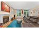 Bright living room showcases a fireplace, large window, and comfortable seating at 635 N Williams St, Denver, CO 80218