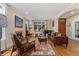 Cozy living room featuring a fireplace, hardwood floors, and comfortable furnishings at 635 N Williams St, Denver, CO 80218