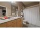 This bathroom offers a large vanity, updated fixtures, and ample lighting at 5677 S Park Pl # A110, Greenwood Village, CO 80111