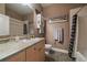 This is a bathroom with a large vanity and updated fixtures at 5677 S Park Pl # A110, Greenwood Village, CO 80111