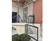 The exterior shot focuses on the entrance, showcasing steps, a metal handrail, and nearby brickwork at 5677 S Park Pl # A110, Greenwood Village, CO 80111