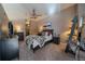 This main bedroom features an attached walk-in closet, a ceiling fan, and is freshly painted at 5677 S Park Pl # A110, Greenwood Village, CO 80111