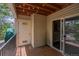 Cozy balcony featuring wood flooring, siding, and a sliding glass door for indoor-outdoor flow at 12208 W Dorado Pl # 207, Littleton, CO 80127