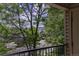 Scenic neighborhood view from private balcony showcasing lush trees and distant houses at 12208 W Dorado Pl # 207, Littleton, CO 80127
