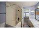 Clean bathroom features a shower/tub combo and a large mirror at 12208 W Dorado Pl # 207, Littleton, CO 80127