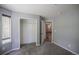 Neutral bedroom with carpet, a closet and a door leading to the en-suite bathroom at 12208 W Dorado Pl # 207, Littleton, CO 80127