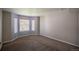 Bright bedroom with neutral paint, carpet, and large windows, offering a blank canvas for personalization at 12208 W Dorado Pl # 207, Littleton, CO 80127