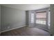 Comfortable bedroom featuring plush carpeting, neutral walls, and natural light through window blinds at 12208 W Dorado Pl # 207, Littleton, CO 80127
