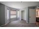 Bright bedroom with neutral paint, carpet, a closet, and a door leading to the en-suite bathroom at 12208 W Dorado Pl # 207, Littleton, CO 80127