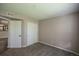 Spacious bedroom with neutral tones, carpet flooring, and large closet, ready for your personal touch at 12208 W Dorado Pl # 207, Littleton, CO 80127