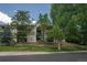 Multi-Gathering residence exterior shows trees, and a small wooden fence at 12208 W Dorado Pl # 207, Littleton, CO 80127