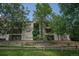 Inviting condo building with mature trees and meticulously maintained landscaping at 12208 W Dorado Pl # 207, Littleton, CO 80127