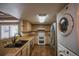 Charming kitchen featuring light wood cabinets and modern stainless steel appliances at 12208 W Dorado Pl # 207, Littleton, CO 80127