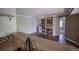 Inviting living room featuring a cozy fireplace, built-in shelving, and hardwood floors at 12208 W Dorado Pl # 207, Littleton, CO 80127