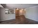 Inviting living room showcases a kitchen view and access to the entry and hallway at 12208 W Dorado Pl # 207, Littleton, CO 80127