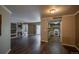 Spacious living room with a fireplace and stylish dark hardwood floors throughout at 12208 W Dorado Pl # 207, Littleton, CO 80127