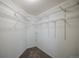 A walk-in closet featuring white walls, carpet, and open wire shelving for ample storage at 12208 W Dorado Pl # 207, Littleton, CO 80127