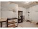 Unfinished basement providing ample storage space with shelving units and water protection at 6792 Canosa St, Denver, CO 80221