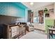 Charming Bedroom featuring a crib, rocking chair, and vibrant wall decor at 6792 Canosa St, Denver, CO 80221