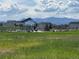Community green space featuring manicured lawns and views of the mountains at 6792 Canosa St, Denver, CO 80221