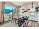 Dining area with a sliding glass door providing access to a deck at 6792 Canosa St, Denver, CO 80221