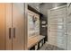 Chic entryway with custom storage, bench, and decorative patterned flooring at 6792 Canosa St, Denver, CO 80221