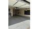 Spacious two car garage featuring a sealed floor, storage system, and an interior access door at 6792 Canosa St, Denver, CO 80221