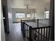 Bright loft area with hardwood floors, large windows, and neighborhood views at 6792 Canosa St, Denver, CO 80221