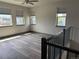 Bright loft area with hardwood floors, large windows, and neighborhood views at 6792 Canosa St, Denver, CO 80221