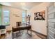Home office with a modern desk, comfortable chair, and natural light from two windows at 6792 Canosa St, Denver, CO 80221