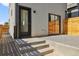Private backyard features minimalist landscaping and concrete steps leading to the main door at 1236 N Tennyson St, Denver, CO 80204
