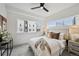 Bright bedroom with neutral tones, a large window, and modern decor at 1236 N Tennyson St, Denver, CO 80204