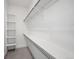 Organized walk-in closet featuring sturdy shelving and chrome hanging rods for efficient storage of your wardrobe at 1236 N Tennyson St, Denver, CO 80204