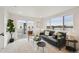 Bright living room boasting modern decor, large windows with scenic views, and comfortable seating for relaxation at 1236 N Tennyson St, Denver, CO 80204