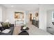 Cozy living room featuring modern furnishings, stylish decor, and a convenient wet bar for entertaining guests at 1236 N Tennyson St, Denver, CO 80204