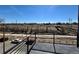 Breathtaking view from the balcony overlooking green space, walking trail, and a pedestrian bridge at 1236 N Tennyson St, Denver, CO 80204
